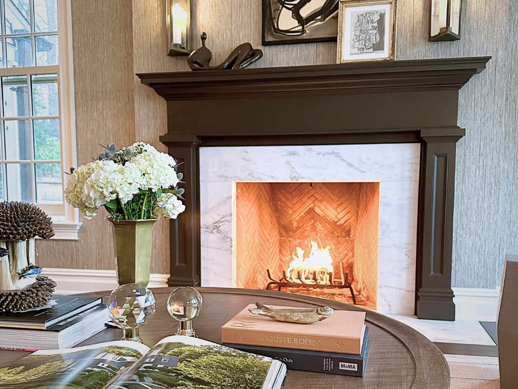 Family room interior showing fireplace and decorated coffee table